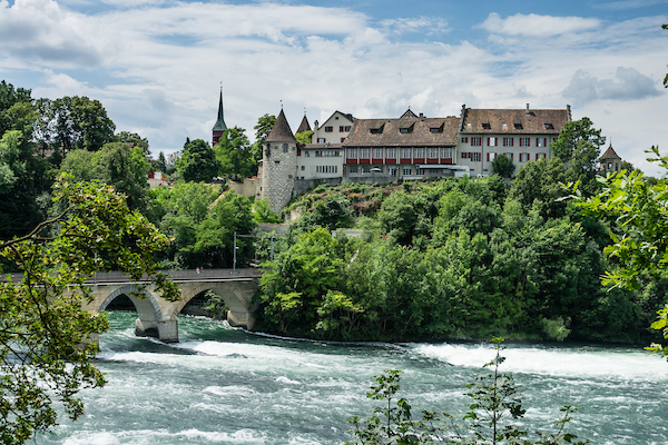 Above the Rhine Falls, you'll find one of the prettiest castles in Switzerland.